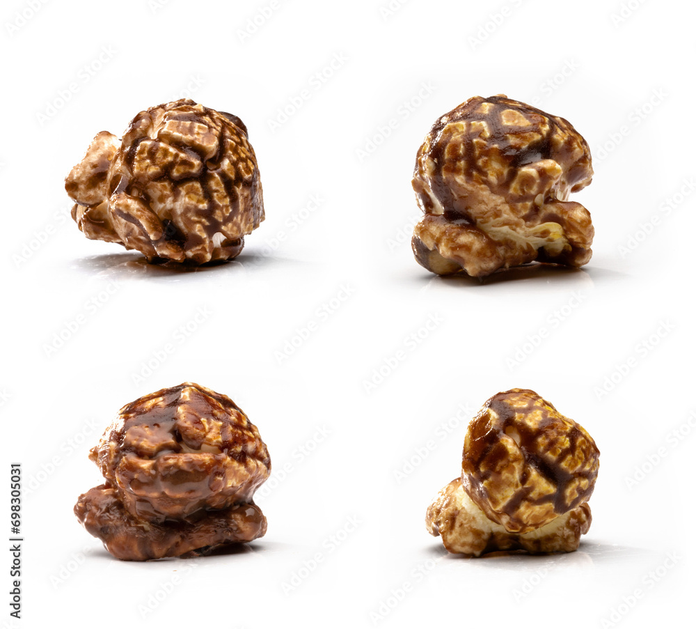Closeup of caramel-flavored, brown, sweet popcorn on a white background Closeup of caramel-flavored, brown, sweet popcorn on a white background