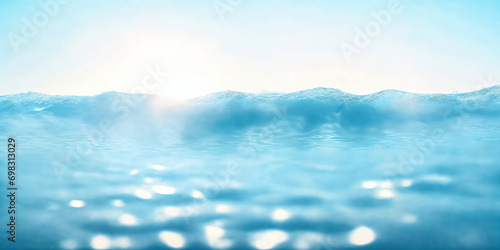 Light blue blurred background with wave texture on sea surface, sky and water border
