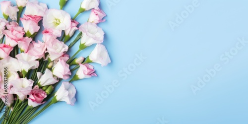 Spring flowers. Bouquet of LISIANTHUS AND EUSTOMA flowers on pastel background. Valentine's Day, Easter, Birthday, Happy Women's Day, Mother's Day. Flat lay, top view, copy space for text