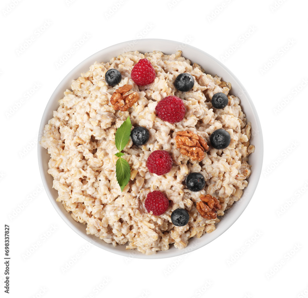 Tasty boiled oatmeal with berries and walnuts in bowl isolated on white, top view Tasty boiled oatmeal with berries and walnuts in bowl isolated on white, top view
