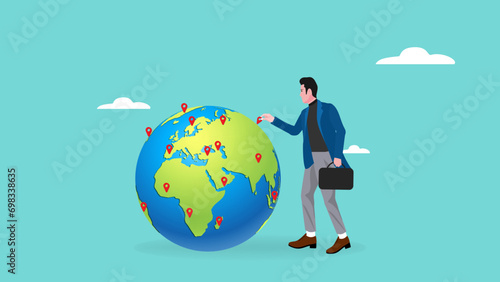 Businessman put new branch pin on world map across globe. Global business expansion, open company branches, franchise in new location to cover all continent. growing business worldwide concept