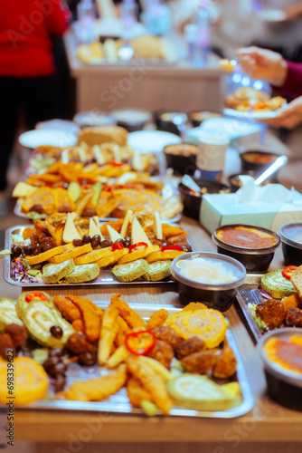 Different foods served on a tray at a Swedish Buffet Party. Many snacks on a table at a festive gathering
