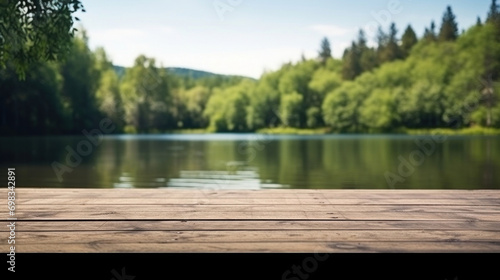 The serene view of a calm lake from the perspective of a wooden dock surrounded by lush forest.
