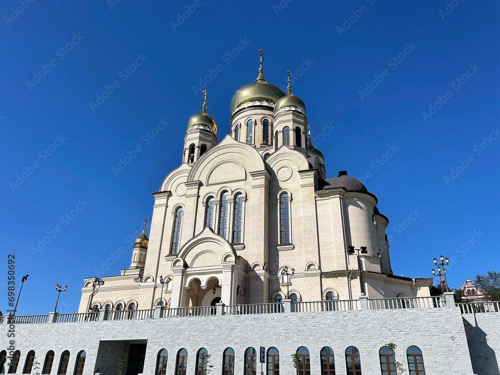 Fototapeta premium Transfiguration Cathedral in autumn from the side of Ship (Korabelnaya) embankment. Vladivostok, Russia