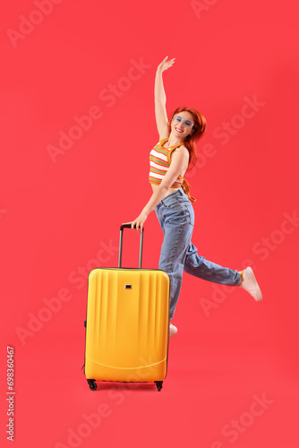 Jumping female tourist with...