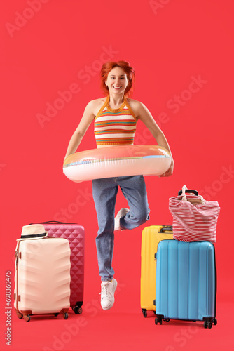 Jumping female tourist with...