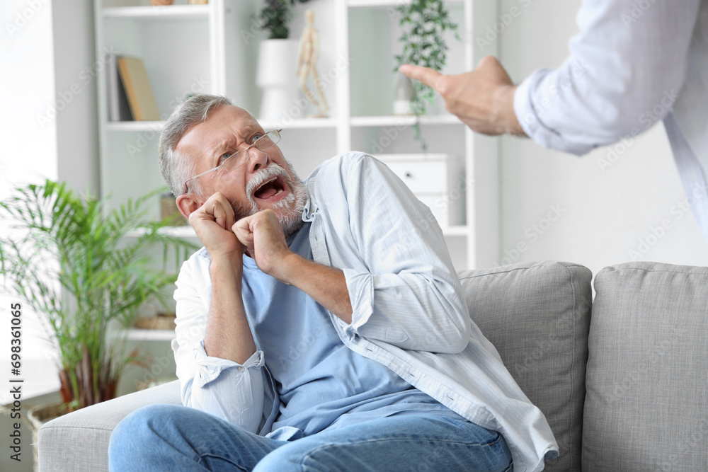 Senior man scared of his angry son at home Senior man scared of his angry son at home