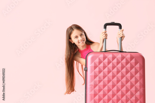 Happy little girl with suit...