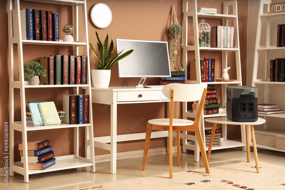 Interior of office with portable power station and workplace Interior of office with portable power station and workplace
