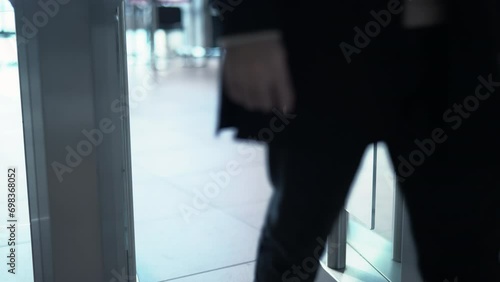 Man passing through the security gates. Media. Man using turnstile to enter the shopping center or subway. photo
