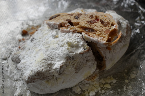 Thinly sliced stollen on stollen loaf