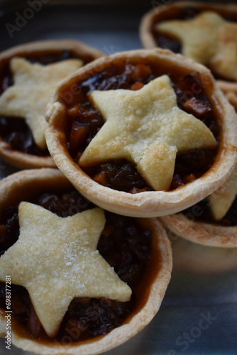 Freshly baked mince pie with star-shaped pie crust lid. 