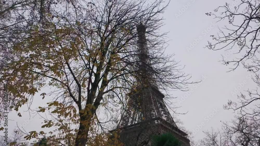 B-roll of Eiffel Tower behind trees on a cloudy day B-roll of Eiffel Tower behind trees on a cloudy day