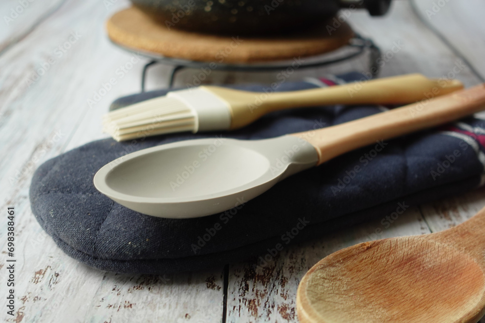 wooden cutlery forks and cooking pan on table wooden cutlery forks and cooking pan on table