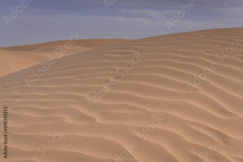 The background image of the sand texture created by the wind, erosion