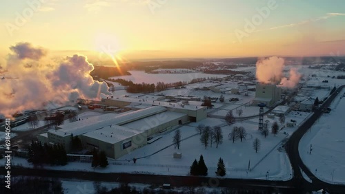 District heating plant in winter at sunset - aerial parallax photo