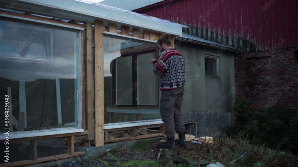 Skilled Man Is Constructing A Hothouse In Its Backyard. Timelapse Skilled Man Is Constructing A Hothouse In Its Backyard. Timelapse