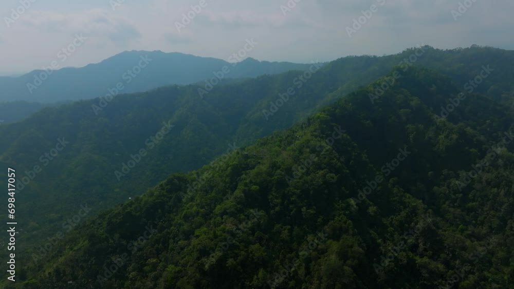 Mystic and foggy drone flight over tropical rainforest. Agung volcano slope Mystic and foggy drone flight over tropical rainforest. Agung volcano slope