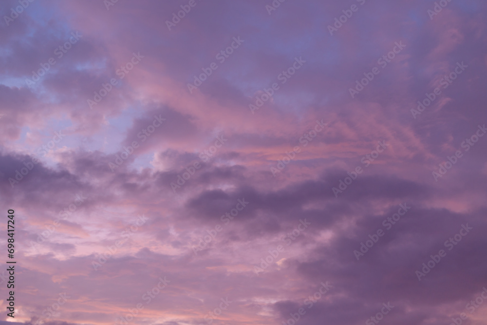 Lilac clouds at sunset. Texture of evening clouds. Beautiful natural background