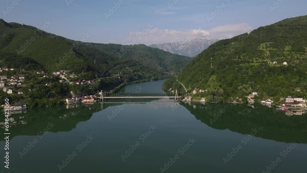 Aerial drones fly over the canyon of jablanica lake, bridge connecting the river Aerial drones fly over the canyon of jablanica lake, bridge connecting the river