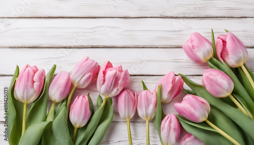 Pink Tulips on white wooden background with copy space