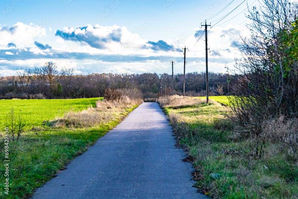 Beautiful empty asphalt road in countryside on colored background Beautiful empty asphalt road in countryside on colored background