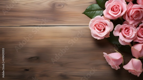beautiful rose flowers on a wooden table  copy space