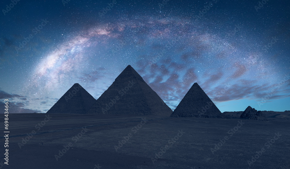 The Milky Way rises over the Pyramids in Giza, Egypt - obrazy, fototapety, plakaty 