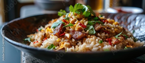 Chinese-style fried rice with roasted pork sausage, dried shrimp, peanuts, and coriander.