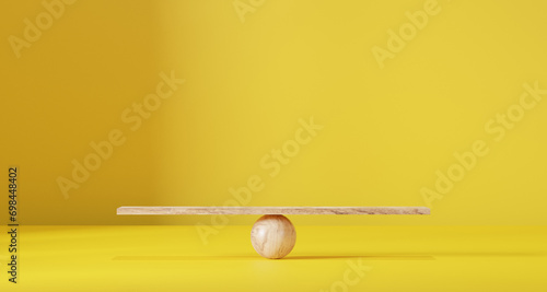 Wooden scales on a yellow background. photo