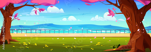 Sunny day in spring park near lake water. Vector cartoon illustration of cherry blossom petals flying in air, green lawn with flowers in shadow of old sakura trees, clouds and birds in blue sky