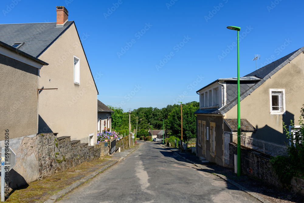 A traditional village old seaside resort in the middle of the countryside in Europe, France, Burgundy, Nievre, Saint-Honoré-les-Bains, towards Chateau Chinon, in summer on a sunny day. A traditional village old seaside resort in the middle of the countryside in Europe, France, Burgundy, Nievre, Saint-Honoré-les-Bains, towards Chateau Chinon, in summer on a sunny day.