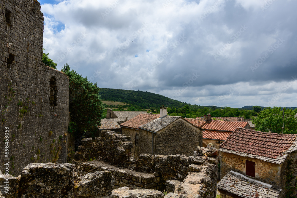 The streets of the medieval village in Europe, France, Occitanie, Aveyron, La Couvertoirade, in summer, on a sunny day.