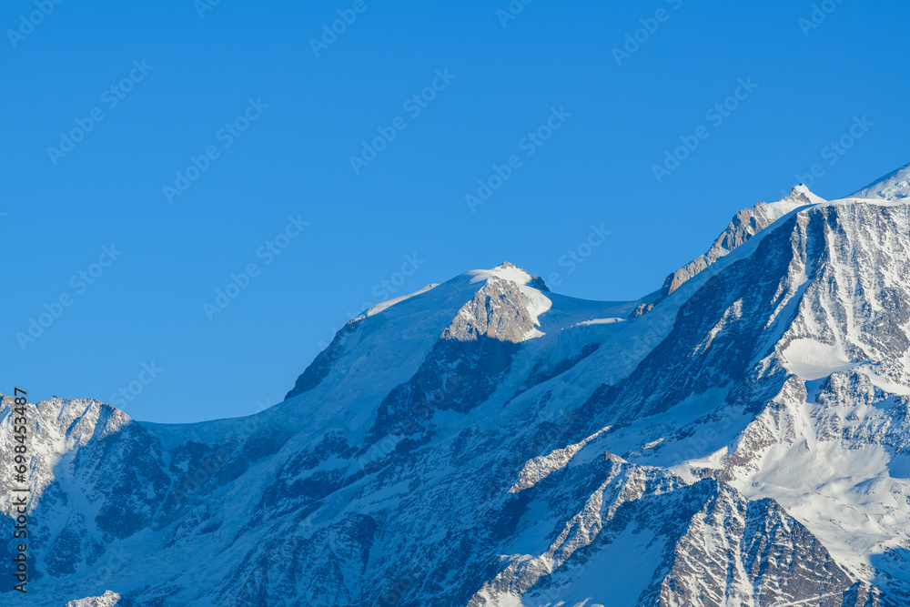 Mont Blanc du Tacul snow capped in Europe, France, Rhone Alpes, Savoie, Alps, in winter on a sunny day.