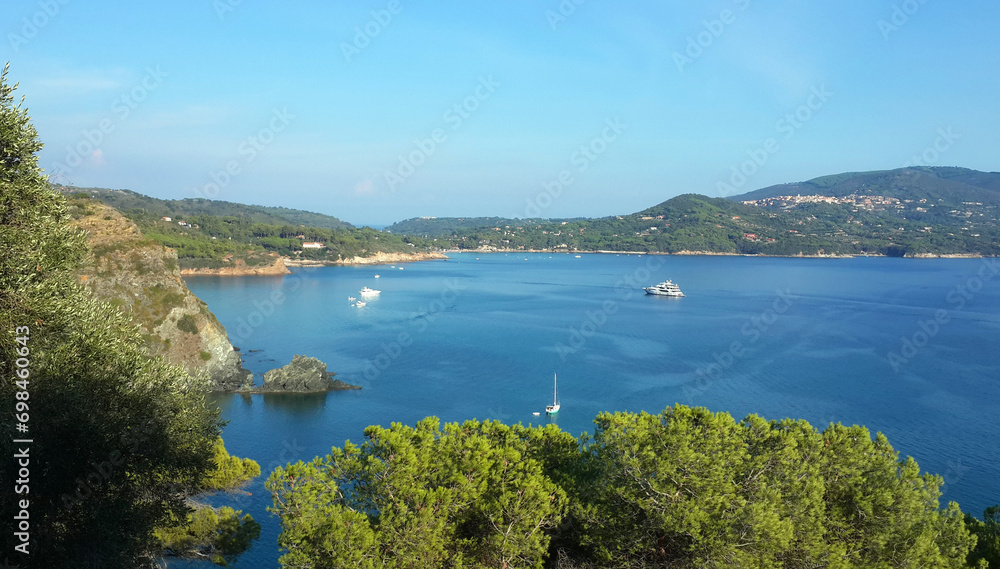 long coast with beach with beautiful blue Tyrrhenian sea in summer in Elba island in Italy