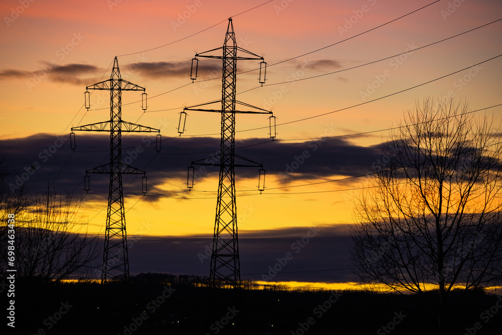Electric poles and the sunrise. Electricity networks