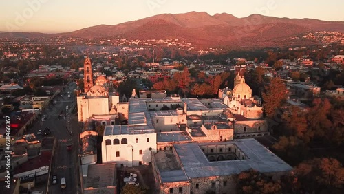 Static drone shot of sunrise over the Viceroyalty Museum in Tepotzotlan, Mexico photo