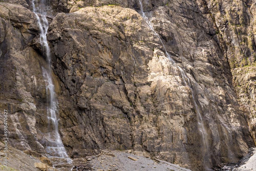 The Cirque de Gavarnie waterfalls , Europe, France, Occitanie, Hautes-Pyrenees, in summer on a sunny day. The Cirque de Gavarnie waterfalls , Europe, France, Occitanie, Hautes-Pyrenees, in summer on a sunny day.