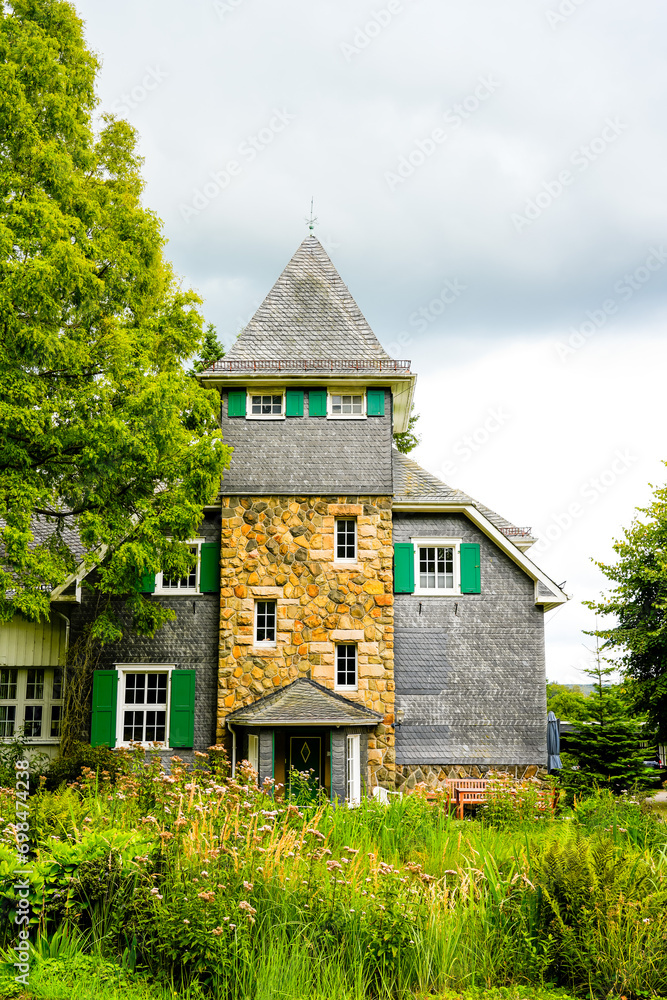 Fototapeta premium Idyllic well-kept house in the countryside. 