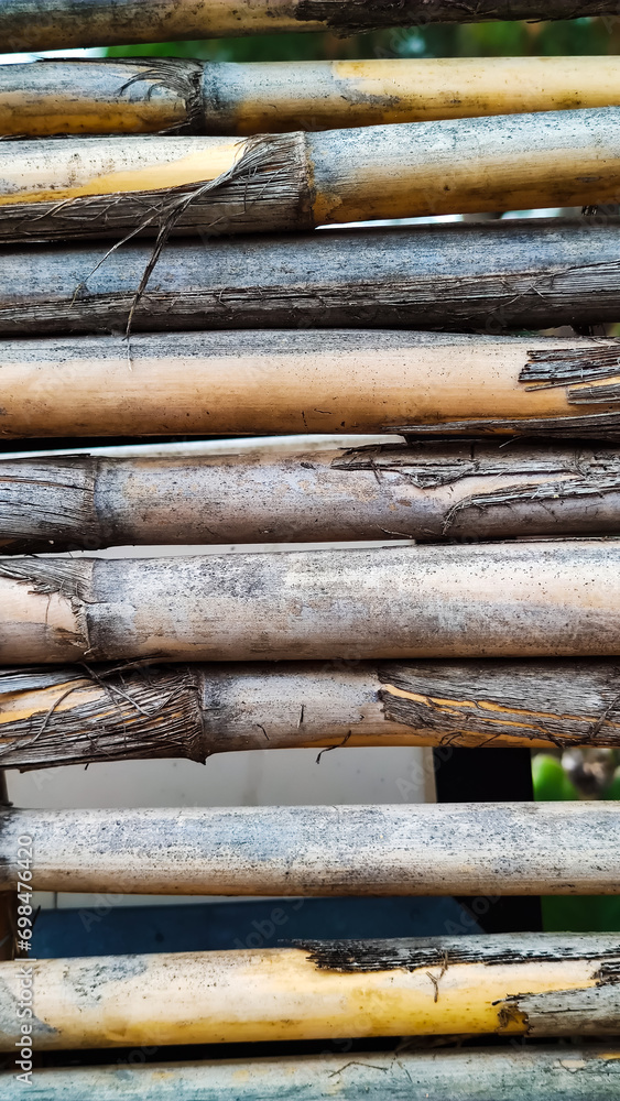 Background texture of dry reed cane. Flat lay, vertical frame, close-up