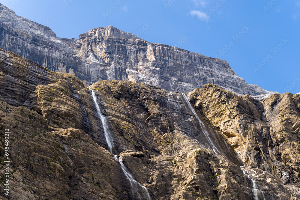 The Cirque de Gavarnie waterfalls , Europe, France, Occitanie, Hautes-Pyrenees, in summer on a sunny day.