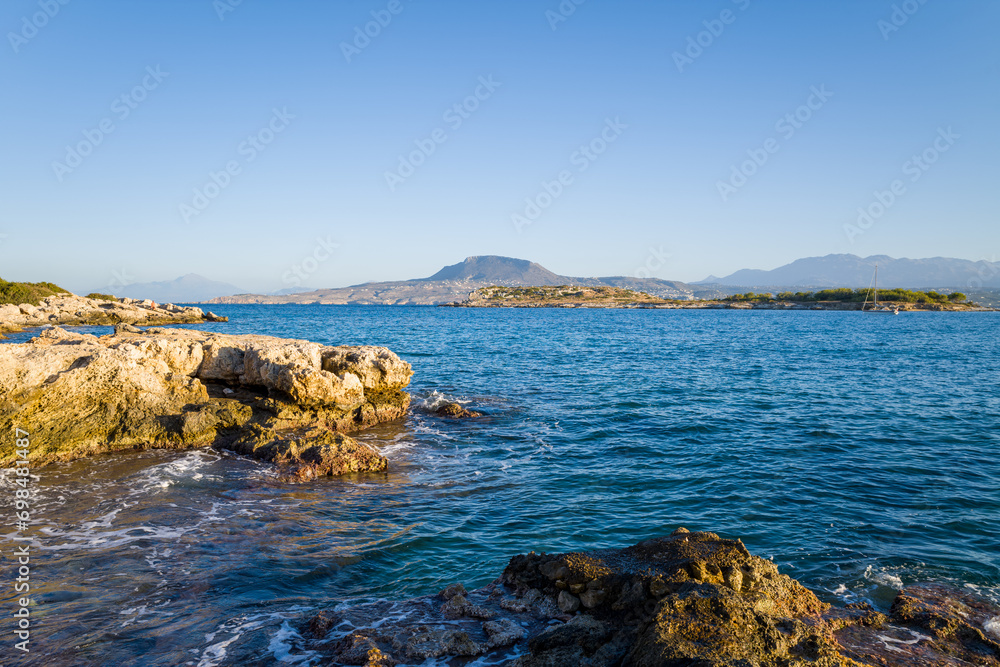 The rocky coast, in Europe, in Greece, in Crete, on the peninsula of Akrotíri, towards Chania, By the Mediterranean Sea, in summer, on a sunny day.
