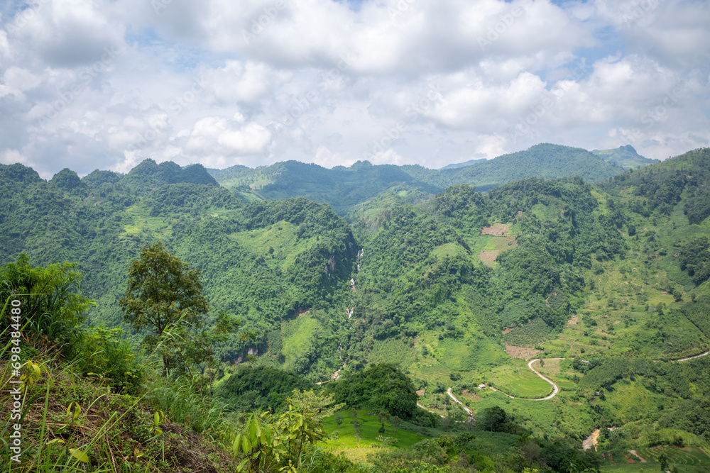 Green mountains and forests , in Asia, Vietnam, Tonkin, Bac Ha, towards Lao Cai, in summer, on a sunny day.
