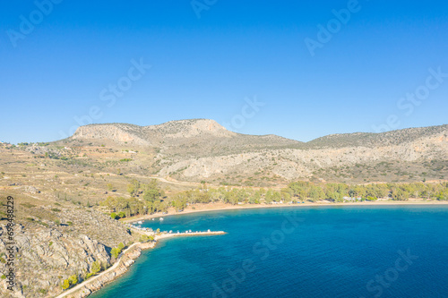 Paralia karathona beach port on arid coast , Europe, Greece, Peloponnese, Argolis, Nafplion, Myrto seashore in summer on a sunny day. photo