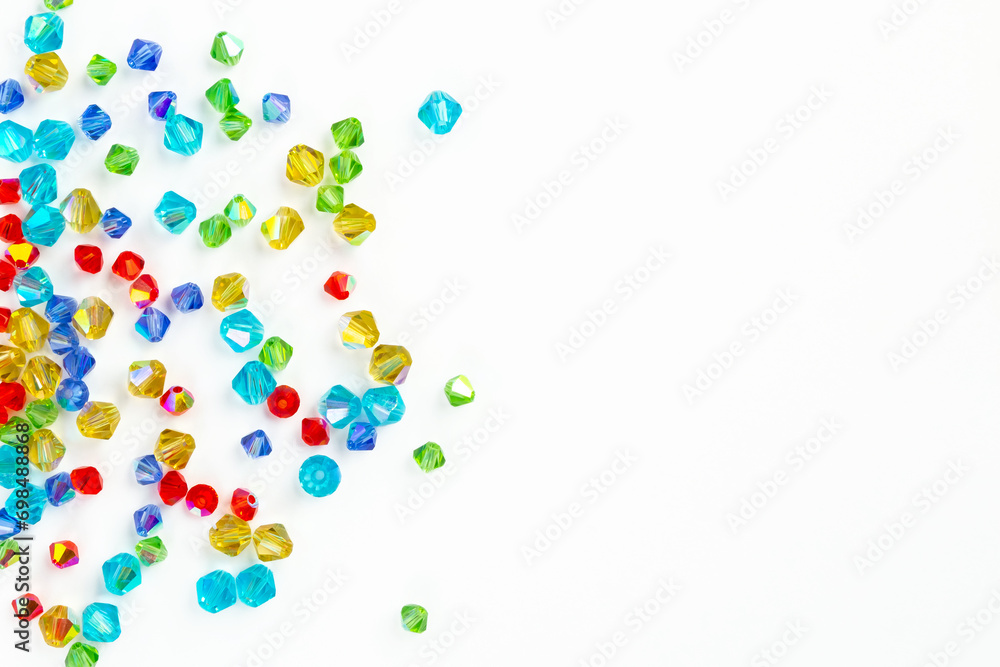 White background with multi-colored beads White background with multi-colored beads