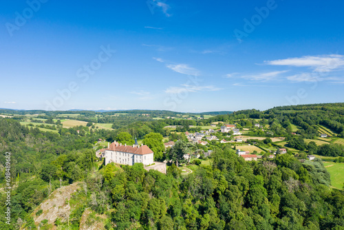 The ancient village in the green countryside in Europe  France  Burgundy  Nievre  Larochemillay  towards Chateau Chinon  in summer on a sunny day.