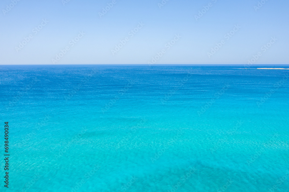 The Mediterranean sea and its heavenly blue colors, in Europe, in Greece, in Crete, towards Kissamos, towards Chania, in summer, on a sunny day.
