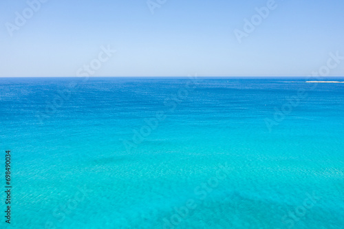 The Mediterranean sea and its heavenly blue colors, in Europe, in Greece, in Crete, towards Kissamos, towards Chania, in summer, on a sunny day.