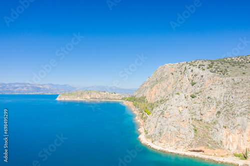 The castles and fortress of the city seen from afar , Europe, Greece, Peloponnese, Argolis, Nafplion, Myrto seaside, in summer, on a sunny day.
