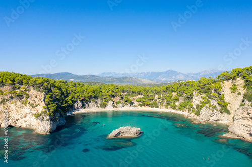 Alonaki Fanariou sandy beach and its green rocky cliffs , in Europe, Greece, Epirus, towards Igoumenitsa, by the Ionian sea, in summer, on a sunny day.